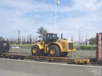 A Caterpillar loader travels CN network on TTX Company HTTX 94204