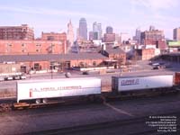 US Xpress Enterprises and Clipper trailers moving a BNSF intermodal train in Kansas City