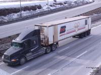 A Volvo truck hauls an old BN America container in Montreal.